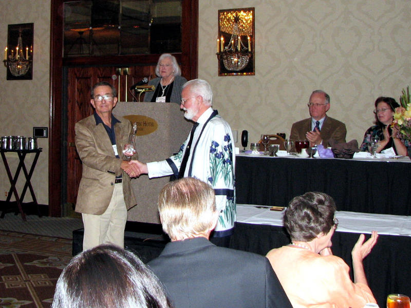 Barry Blyth is presented the Fred and Barbara Walther Cup for 'Decadence,' which he was awarded in 2006  (Photo by Larry Nunn)